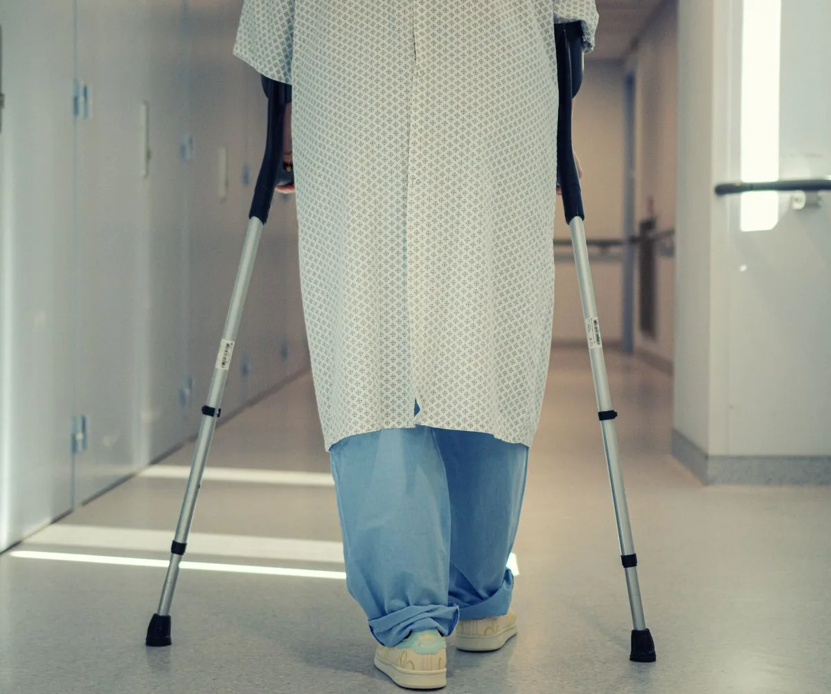 Physical therapist assessing a patient recovering from hip replacement surgery at Ability Allies in Seacoast, NH