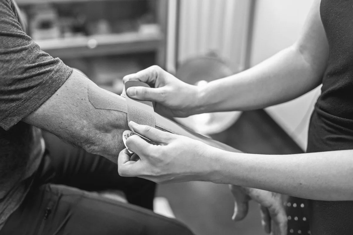 Therapist treating a patient for tendinitis