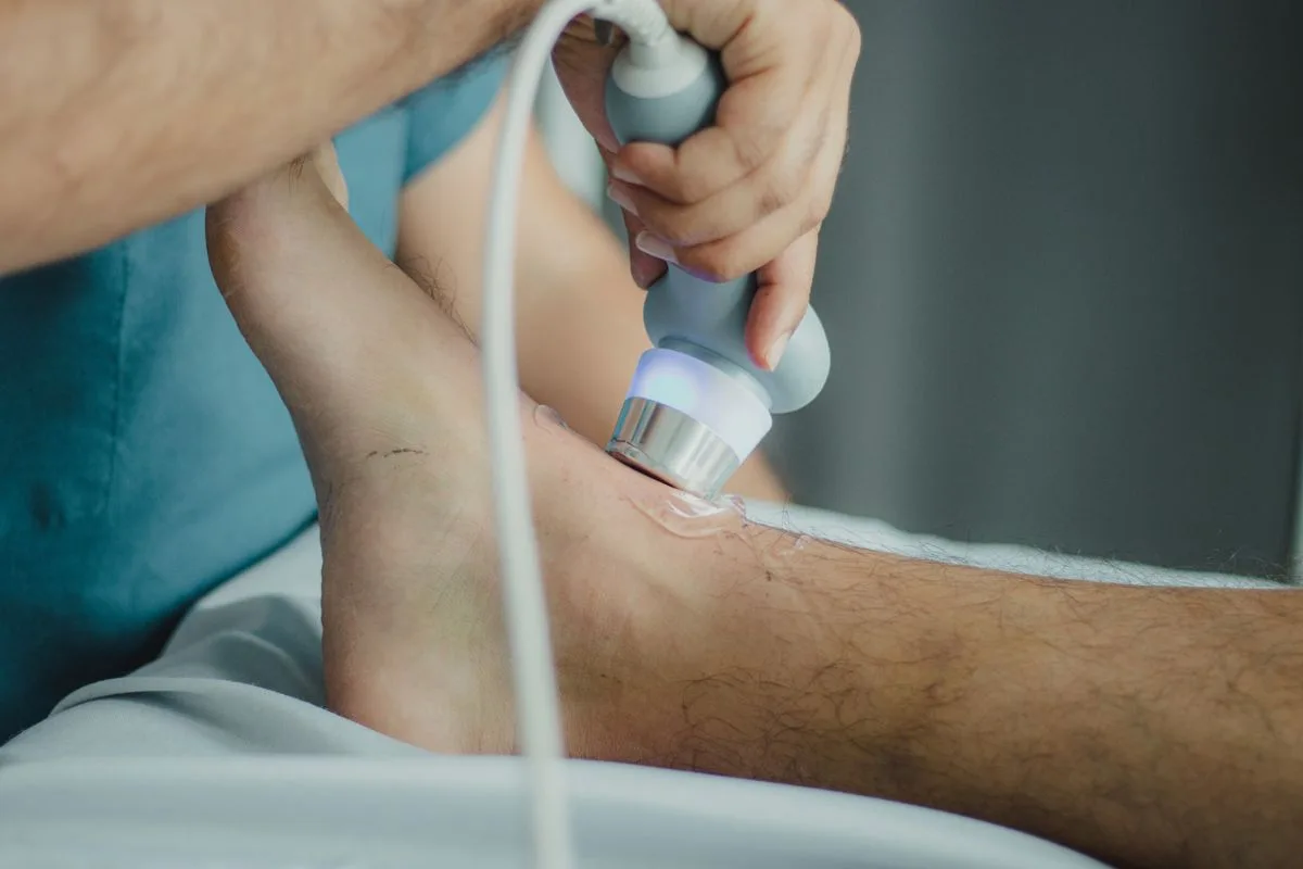 Shockwave therapy device applied to a patient’s heel